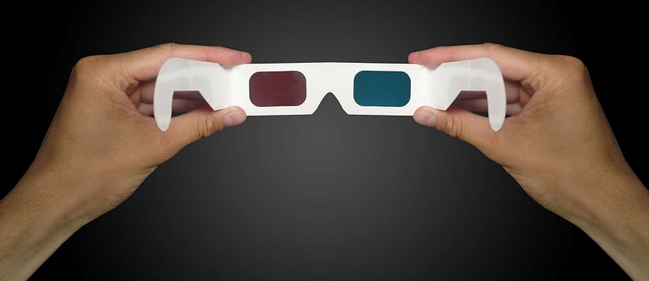 person holding 3D glasses, stereoscopic 3d, 3d cinema, glasses in hand