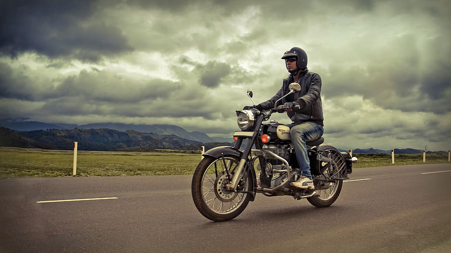 man riding motorcycle on road, bike rider, classic, royal enfield, HD wallpaper