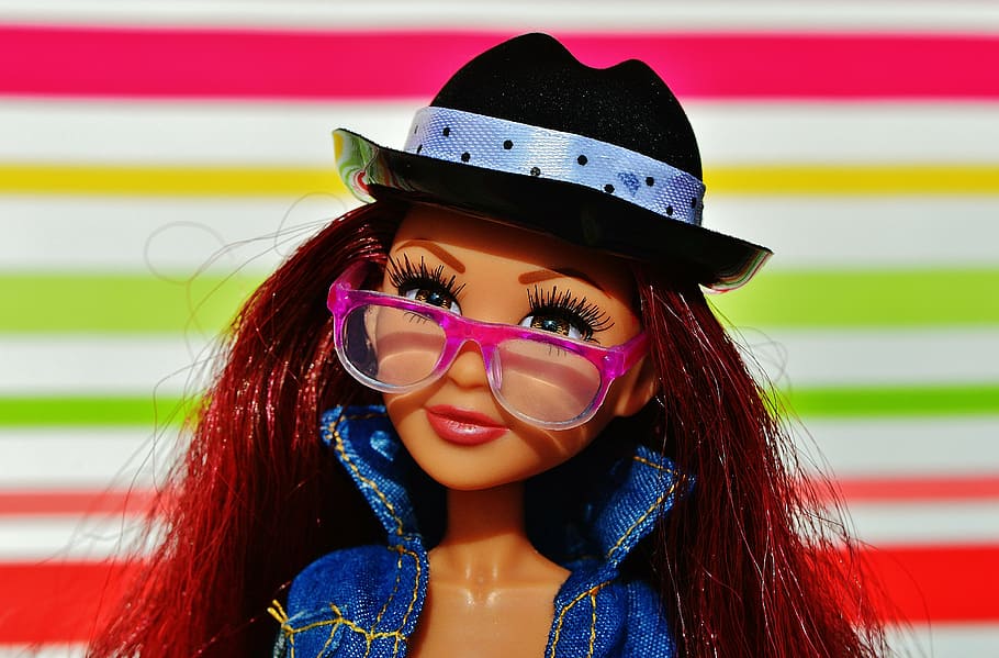 Barbie doll with pink eyeglasses and blue denim jacket, pretty