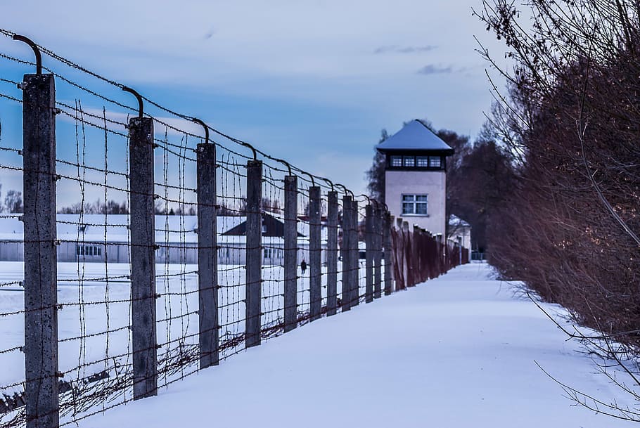 structure enclosed with fence covered in snow, kz, kz dachau