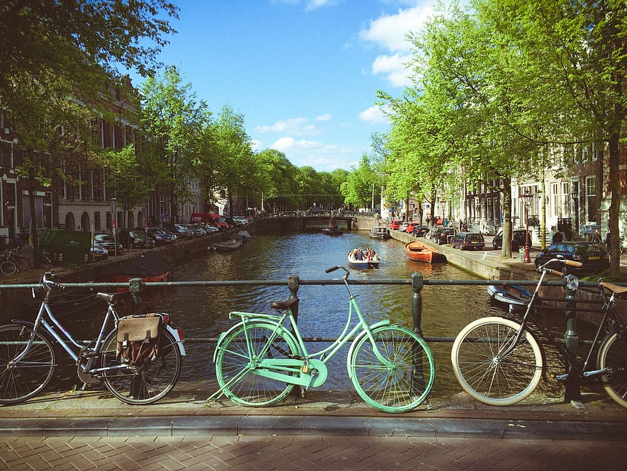bicycles, bike, boats, bridge, buildings, canal, city, cyclist