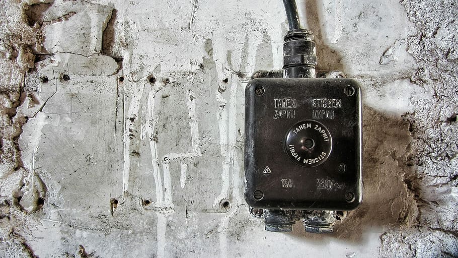 grey and black corded device on wall, square black metal corded electronic device near white pavement HD wallpaper