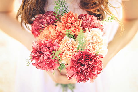 woman wearing , white bridal wedding dress, holding, orange, red,and pink flower bouquet HD wallpaper