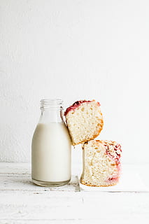 baked bread and black glass of milk, bottle of milk with breads on white wooden table HD wallpaper