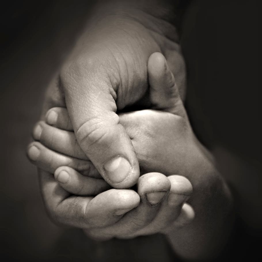 grayscale photo of two person holding hands, dad, together, love