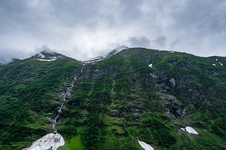 low-angle photo of green mountain at daytime, green mountain under white sky HD wallpaper