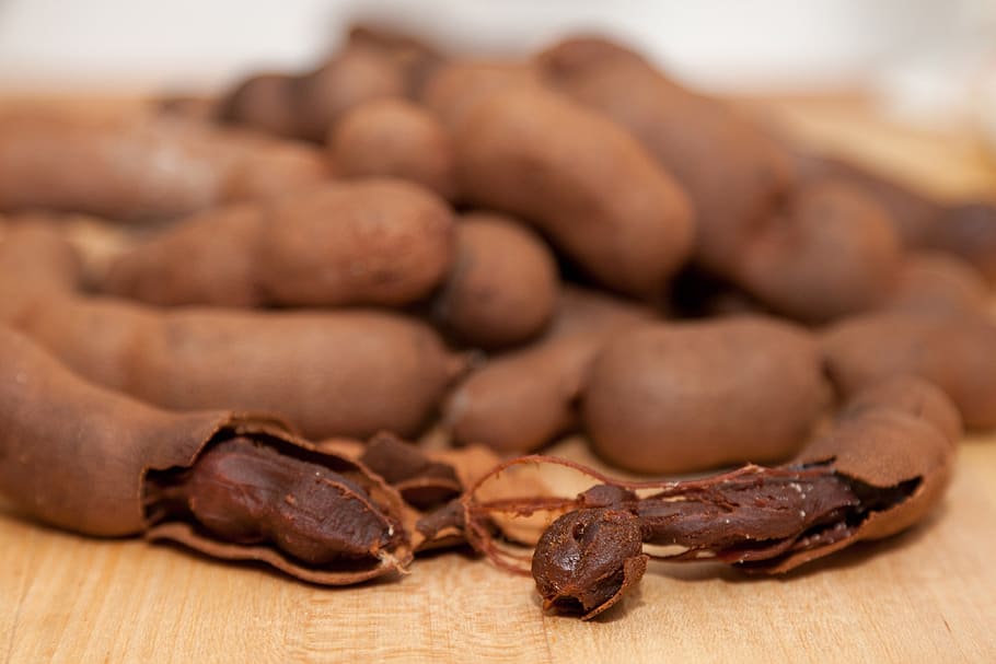 brown tamarind on table, exotic, shell, group, ripe, nutrition, HD wallpaper