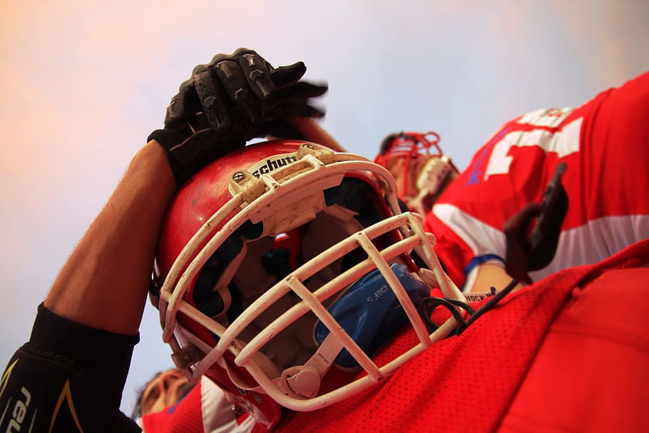 HD wallpaper: football, player, red, facemask, field, game, helmet, sport - Wallpaper Flare