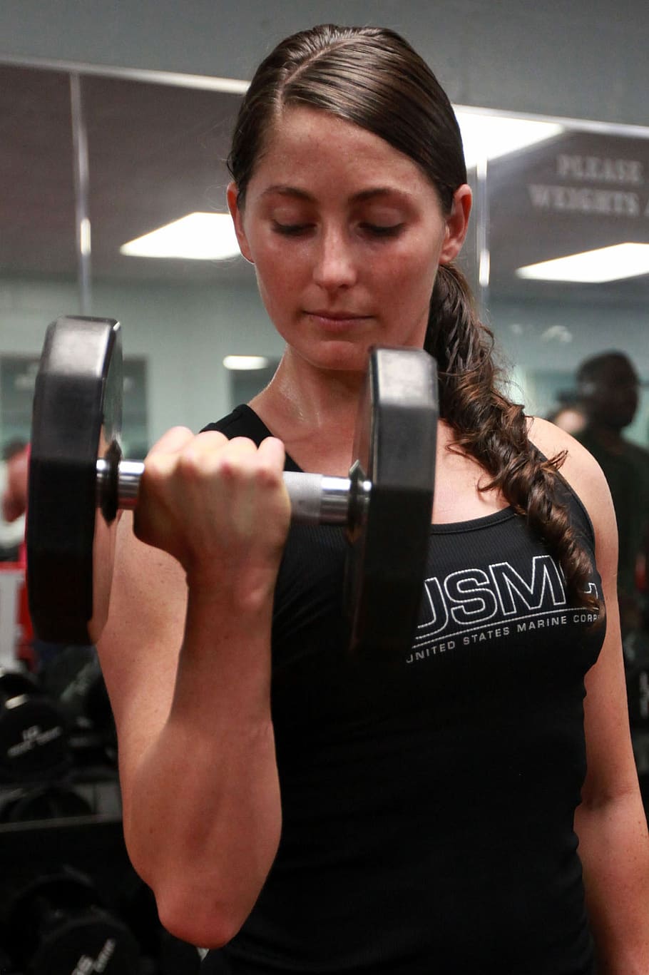 woman in black tank top carrying dumbbell, weights, lifting, power