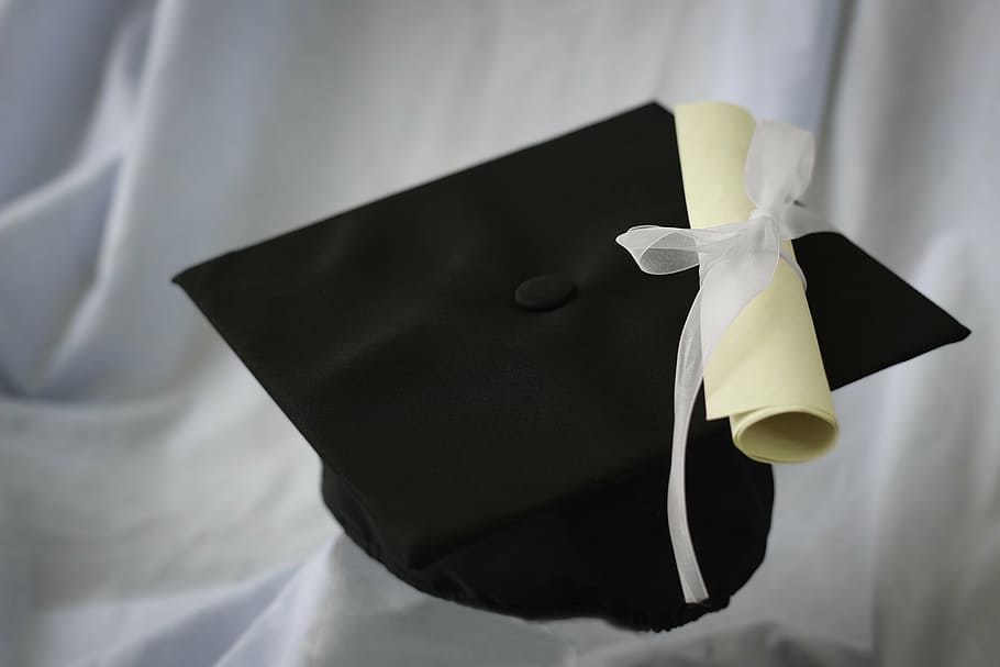 black acamedic hat on white textile, graduation, scroll, cap HD wallpaper