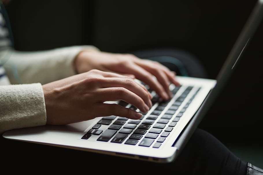 person using laptop, person using white laptop computer, macbook HD wallpaper