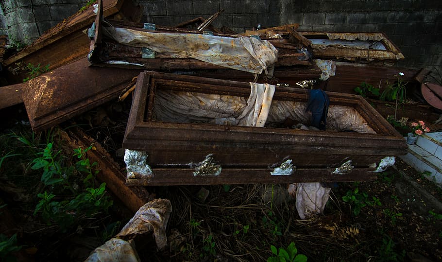 stack of brown coffins, cemetery, venezuela, old, used, damaged