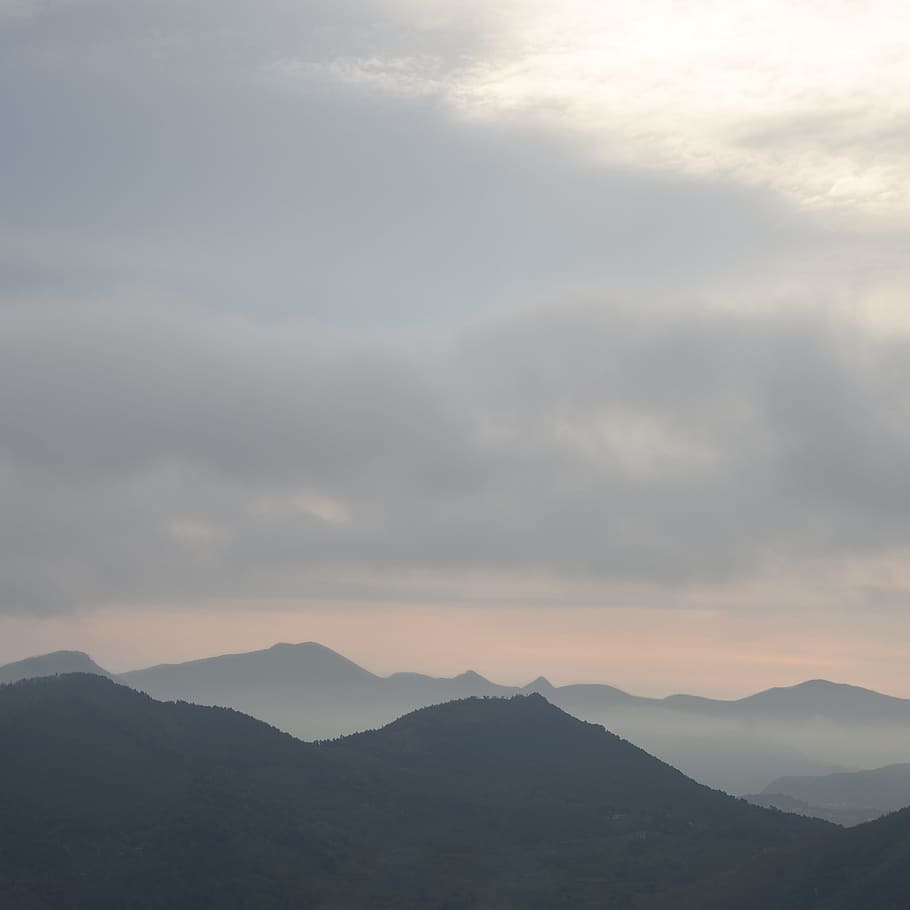 close photo of mountains under gray sky, aerial photography of mountains HD wallpaper
