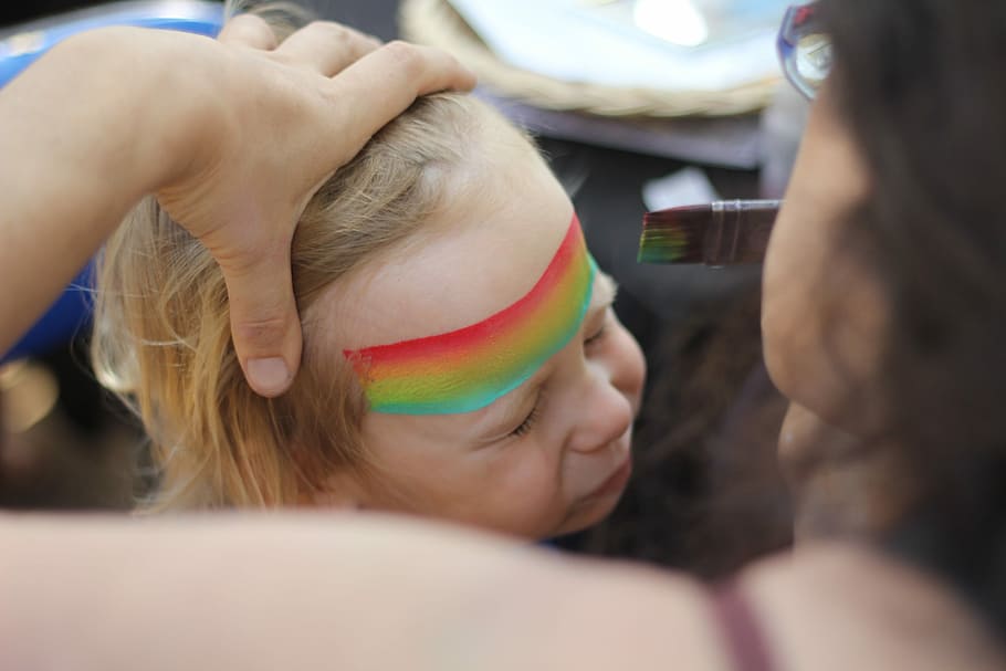 woman stroking child's hair, baby with color paint on forehead HD wallpaper