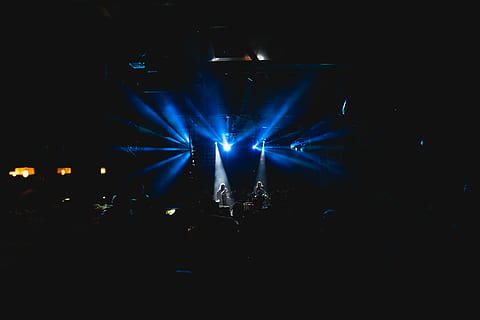men performing live band on stage in front of crowd, photo of blue lights near two standing person HD wallpaper