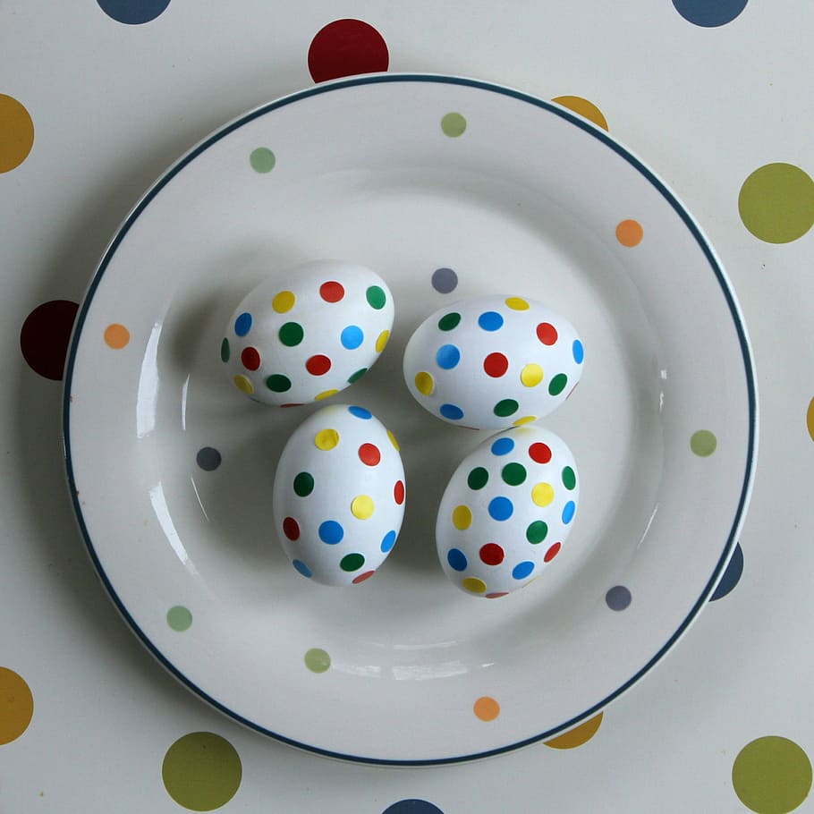 four multicolored Easter Eggs on plate, decoration, celebration HD wallpaper
