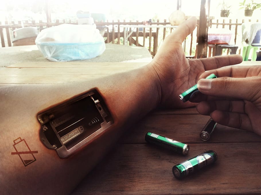 person holding battery, exhausted, fill light, cut here, imagination HD wallpaper