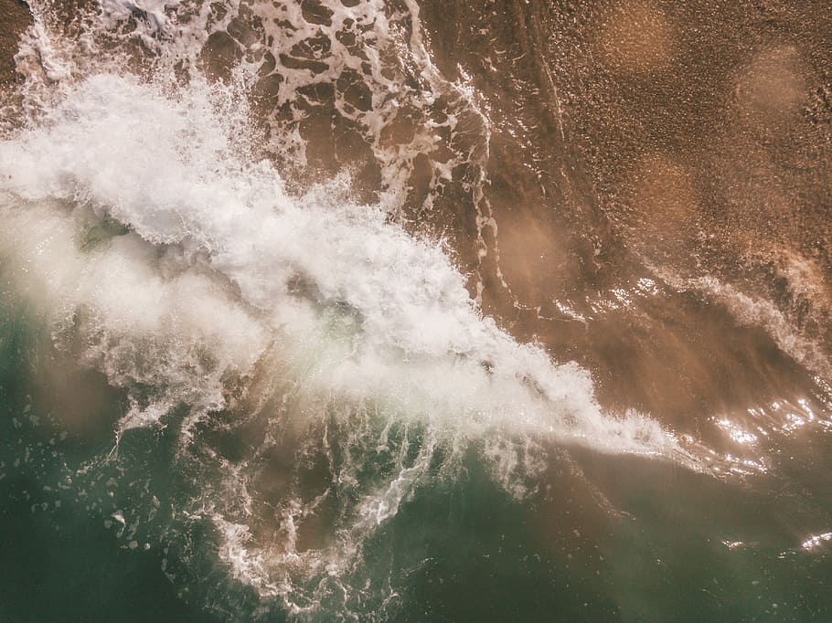 sea waves splashing near seashore at daytime, bird's eye photography of blue ocean HD wallpaper