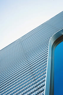 high angle photography of gray concrete building, low-angle photo of gray metal building HD wallpaper
