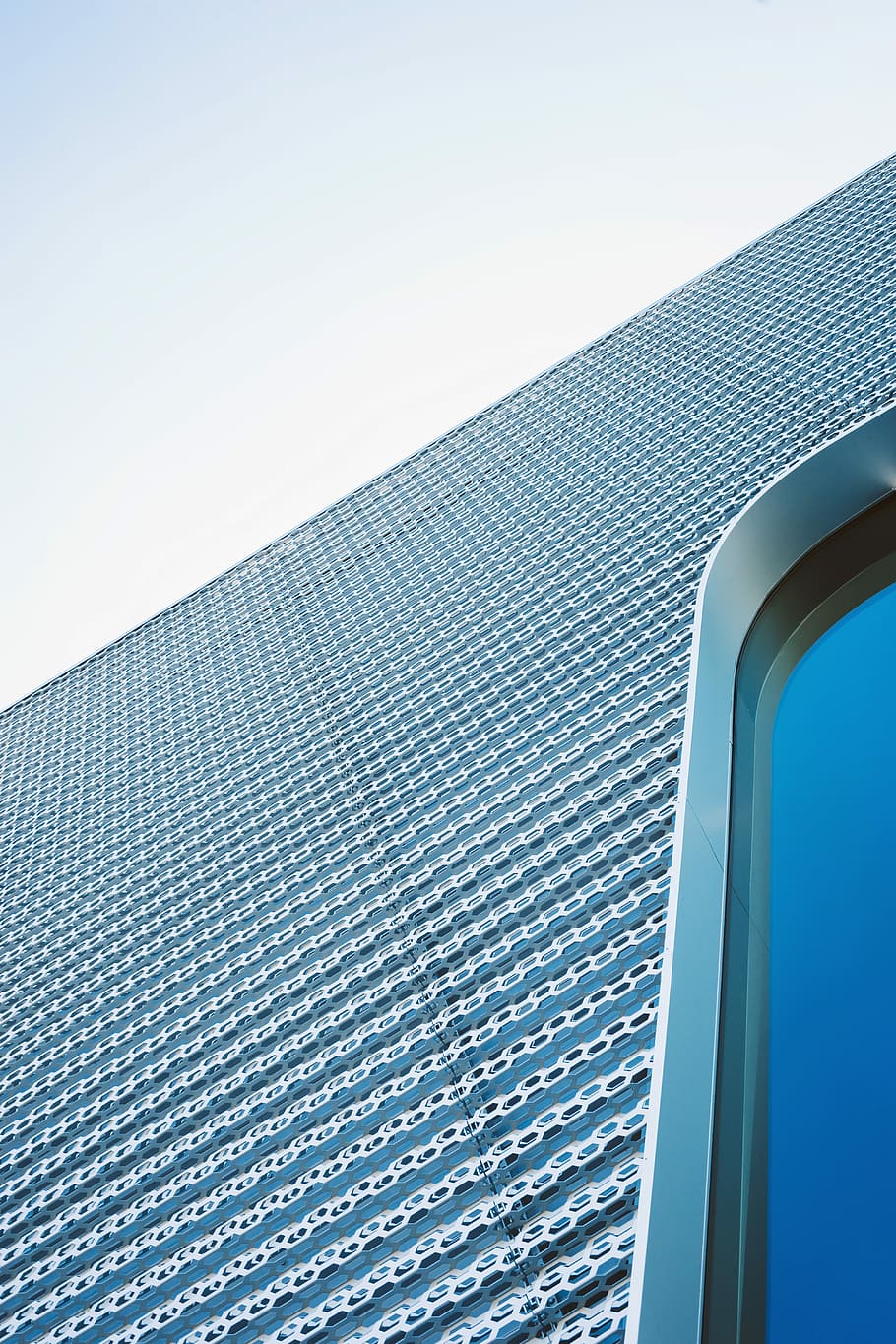 high angle photography of gray concrete building, low-angle photo of gray metal building HD wallpaper