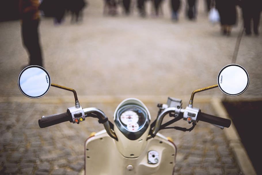 close-up photo of motorcycle, selective focus photo of beige motor scooter on road HD wallpaper