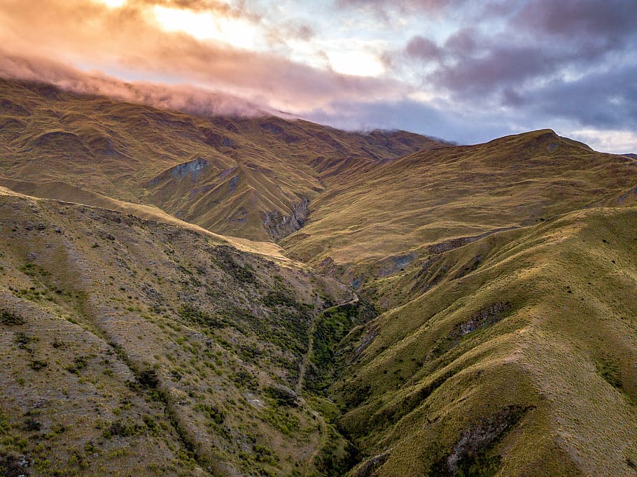 green mountain during daytime, canyon under cloudy sky, drone view HD wallpaper