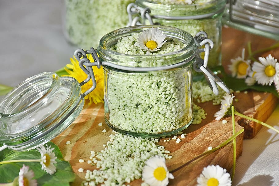 clear glass jar with lid and daisy flowers, salt, bear's garlic