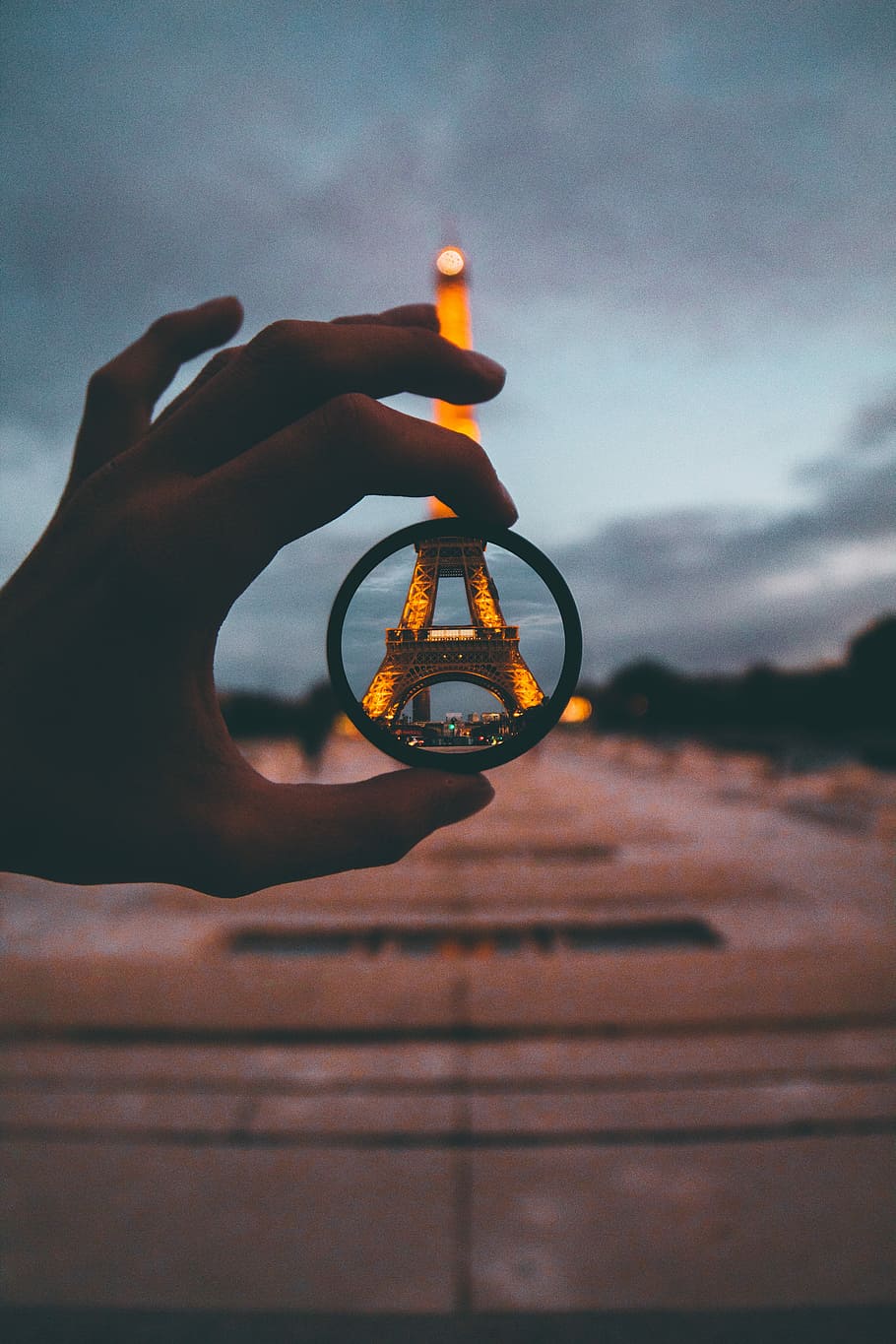 Anywhere I go, selective focus photo of bangle through Eiffel Tower