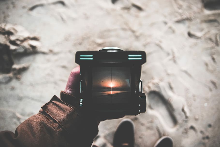 person holding black framed lamp, person holding black lamp, photography HD wallpaper
