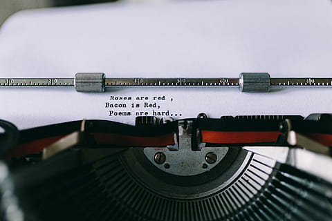 Closeup view of typing quotes on the old typewriter, vintage HD wallpaper
