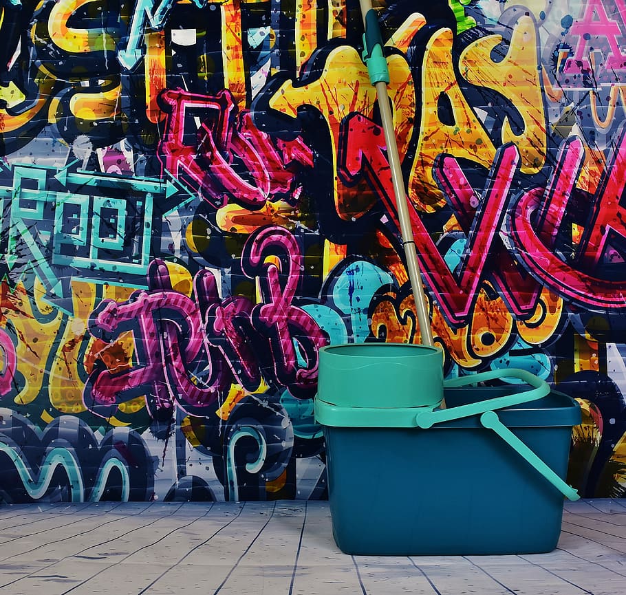 teal and black mop bucket with wringer and mop near wall graffiti HD wallpaper