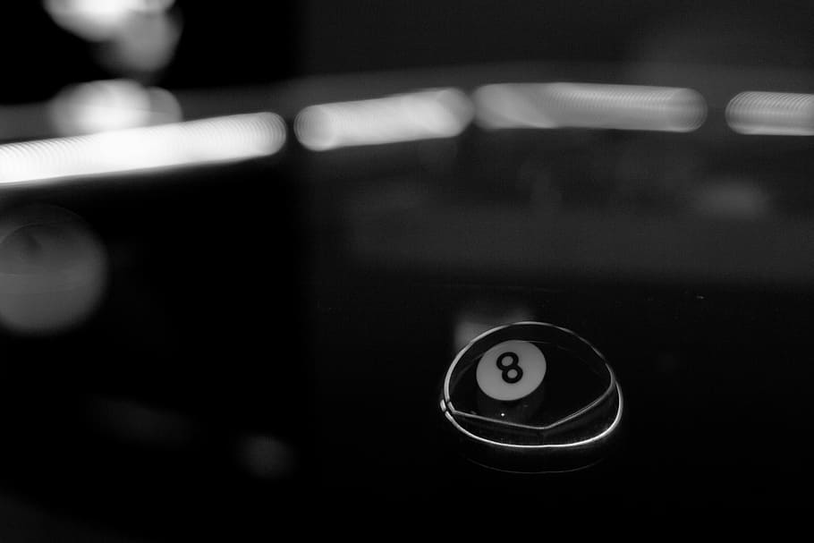 shallow focus photography of 8 ball, grayscale photo of 8 billiard ball