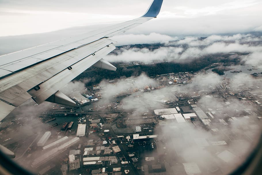 aerial view on a plane, aerial photography of clouds and houses HD wallpaper