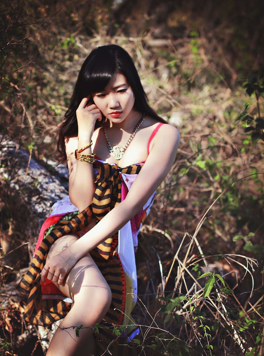 woman wearing red spaghetti strap dress in the forest, girl, vietnam