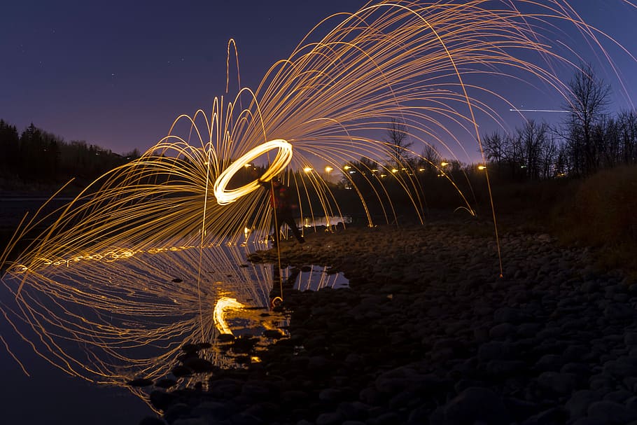 time-lapse photography of person holding lighted steel wool at night, time lapse photography of person holding steel wool HD wallpaper