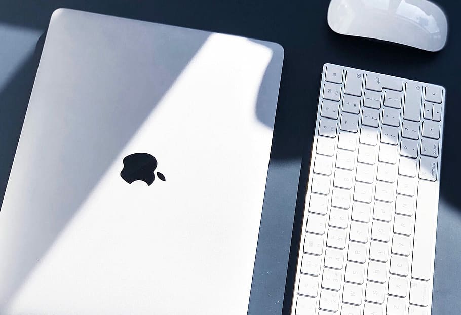 flat lay photography of MacBook white, Apple Wireless Keyboard, and Magic Mouse, silver Macbook near keyboard HD wallpaper