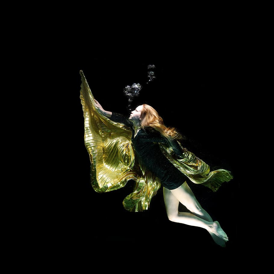 woman in black dress floating underwater, model, fine arts, dom
