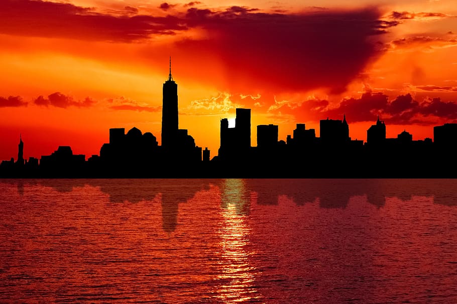 silhouette of New York city skyline at sunset, dusk, evening