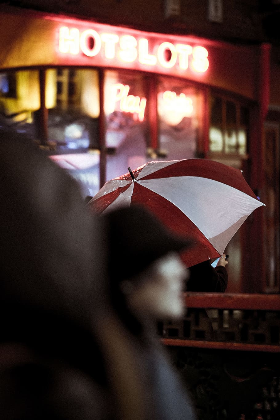 red and white umbrella, person under red and white umbrella near store HD wallpaper