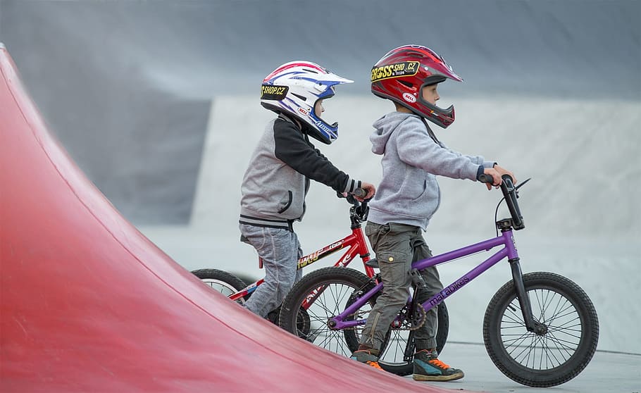 two boys riding bikes, children, bmx, skatepark, sport, headwear, HD wallpaper