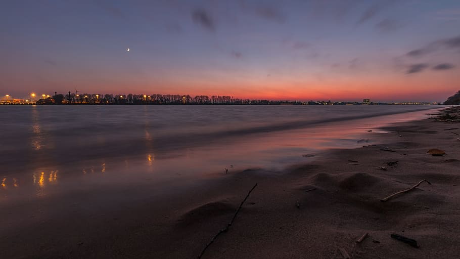 building near sea during blue hour, elbe, water, beach, sunset HD wallpaper