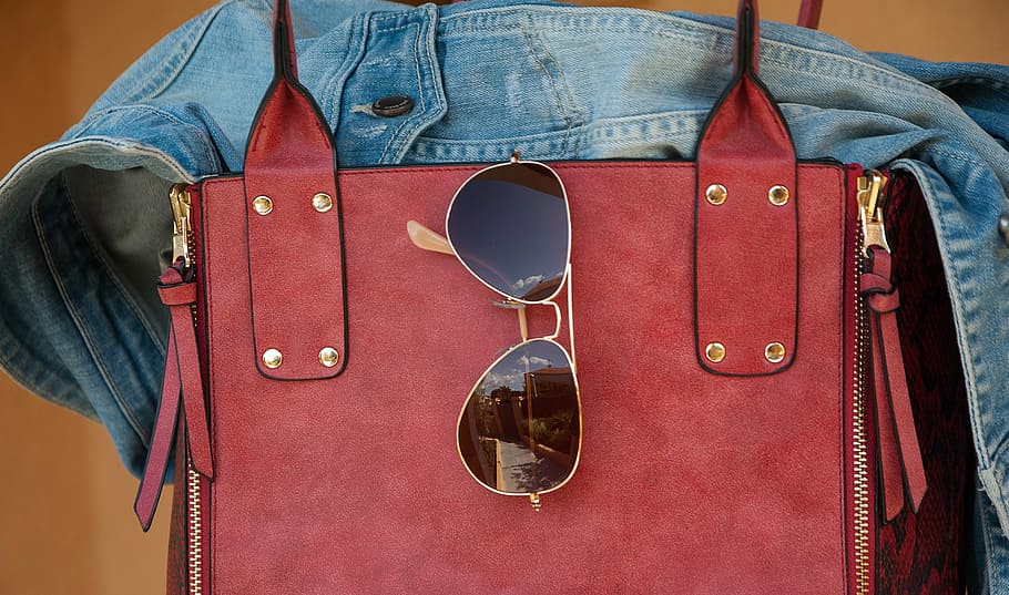 black sunglasses hanging on red leather bag, jacket, clothing HD wallpaper
