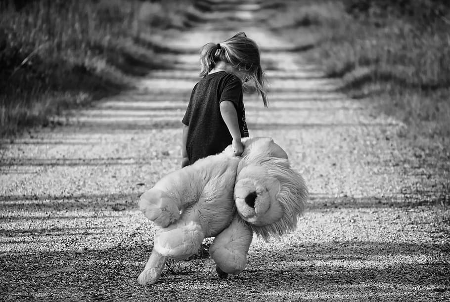 girl in black crew-neck shirt holding lion plush toy in grascale photography, HD wallpaper