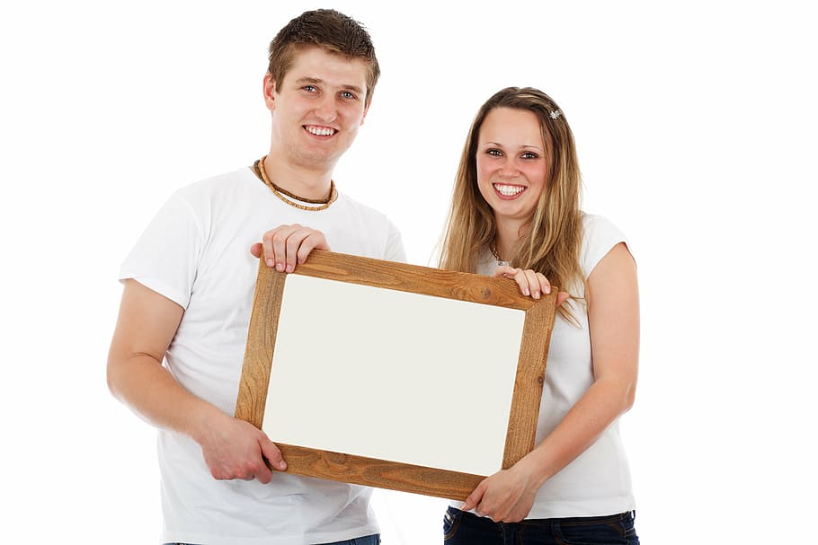 smiling woman and man holding wooden frame, board, blank, border HD wallpaper