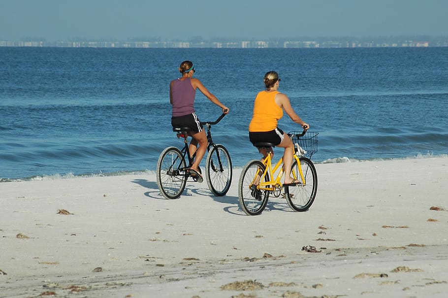 two women riding bicycles, People, Bikes, Exercise, beach, biking HD wallpaper