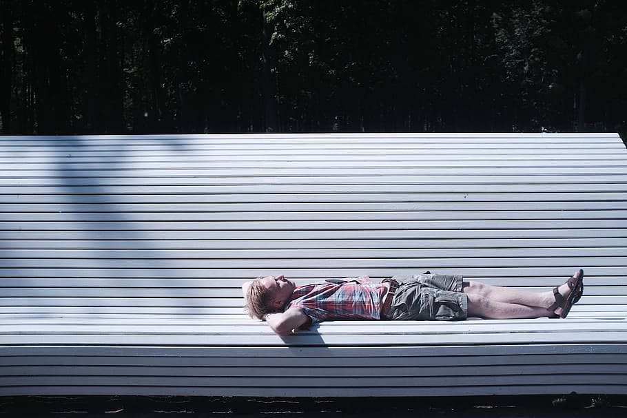 man lying on bench during daytime, woman sleeping on white chair HD wallpaper