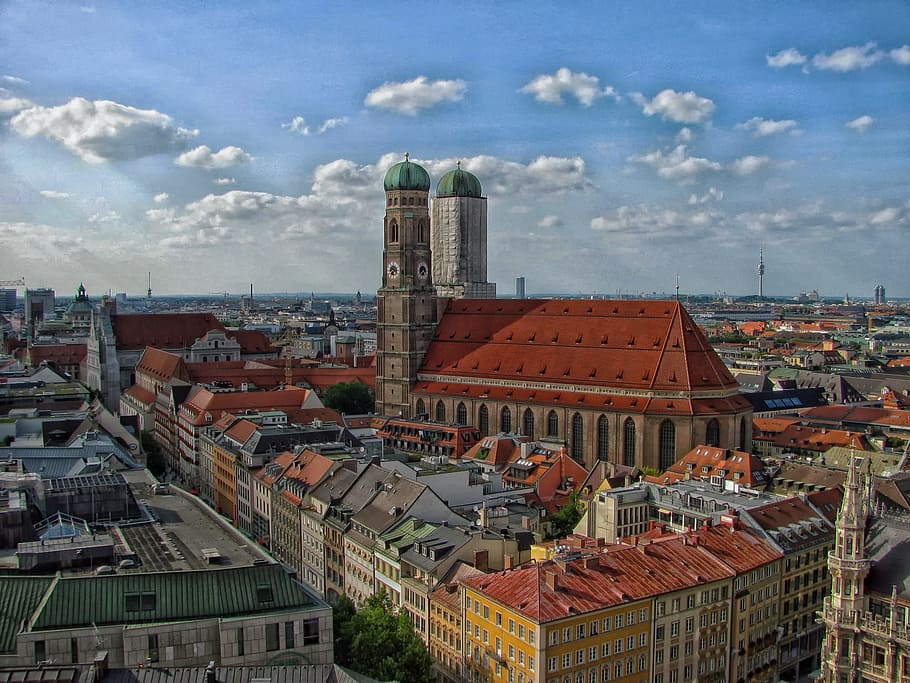 two minarets beside houses under clear sky, munich, germany HD wallpaper