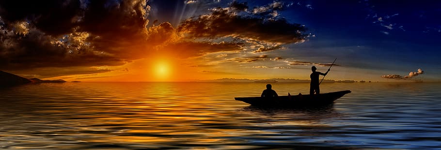silhouette on two person riding boat during golden hour, sunset