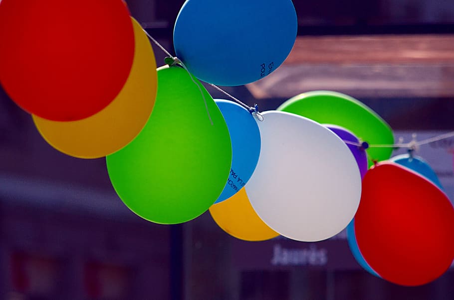 close-up of inflatable balloons, green, yellow,blue, blue and red