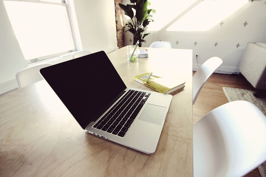 MacBook on table with chair, pro, brown, wooden, beside, yellow HD wallpaper